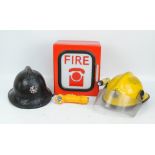 Fire Service interest lot comprising a vintage black fire helmet with remains of Greater Manchester