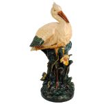 A circa 1900 Continental majolica glazed stick stand in the form of a stork, unmarked,