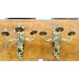 A pair of gilt metal three branch scrolling wall lights, height 44cm.