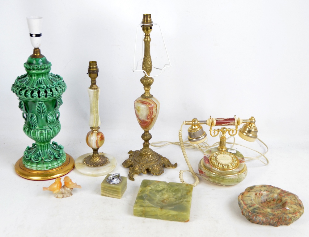 A group of various onyx desk items, including telephone, two lamps and a lighter,