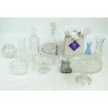 A quantity of clear cut and moulded glass tableware to include three comports, two decanters,