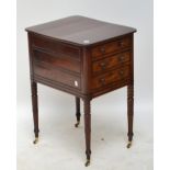 An early 19th century mahogany four drawer side cabinet with later top.