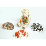 Four Royal Crown Derby paperweights, including 'The Regal Goldie Bear', 'Puppy' and 'Misty',