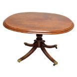 An early 19th century mahogany oval tilt-top loo table with replaced top.