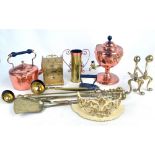 A group of metalware including a copper tea urn and brass three piece companion set.