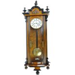 A large Victorian walnut and ebonised eight day twin weight Vienna wall clock,