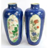 A pair of early 20th century Chinese porcelain ovoid vases painted in enamels with four opposing