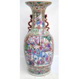 A very large 19th century Chinese Canton Famille Rose baluster vase with flared rim and twin gilt