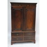 An early 20th century mahogany wardrobe converted from a linen press,