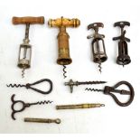 Nine late 19th and early 20th century corkscrews to include a Thomason bone handled example with