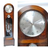 An early 20th century oak three weight longcase clock,