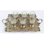 An Iranian base white metal set of six cup holders with glass liners,