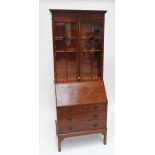 An Edwardian mahogany bureau bookcase.