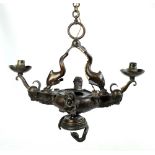 An early 20th century bronze spelter twin branch ceiling lamp cast decorated with dolphins,