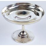 An Edward VII hallmarked silver circular bonbon dish of plain form raised on waisted stem above