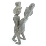 An Eastern erotic bronze modelled as an entwined couple, height 35.5cm.