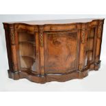 A Victorian inlaid walnut credenza of serpentine outline and with ormolu mounts,