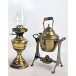 A brass kettle on stand and a brass oil lamp (2).