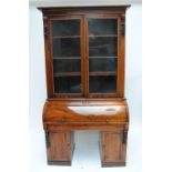 An early to mid-Victorian rosewood cylinder top bookcase,