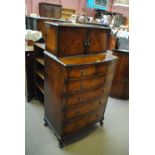 A 19th century crossbanded mahogany bowfronted side cabinet with twin hinged cupboard doors above