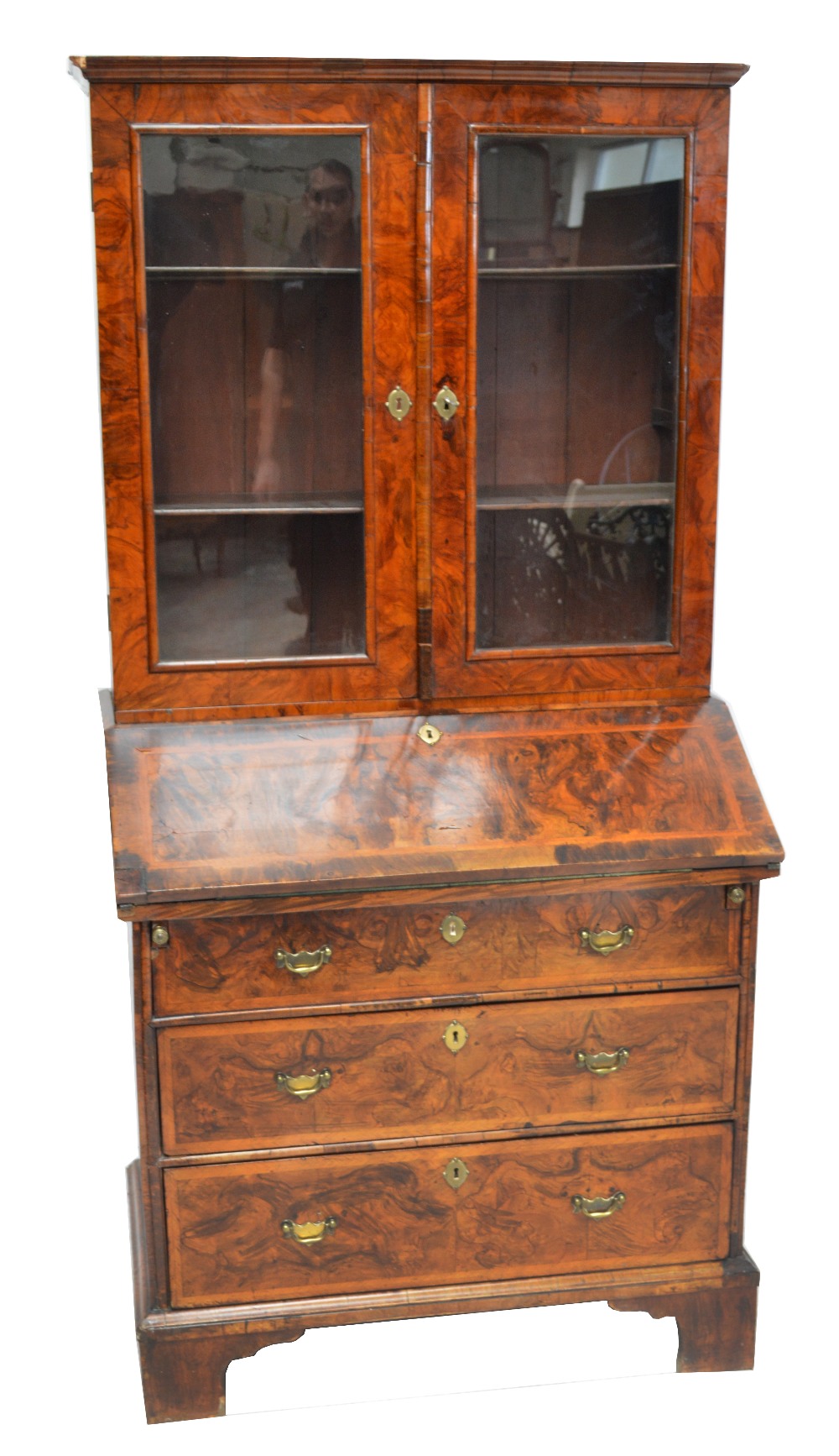 An early 18th century walnut bureau bookcase,