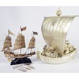 A 20th century Chinese silver miniature model of a three masted boat, length 15cm,