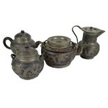 A Chinese ceramic and pewter mounted matched four piece tea set, two pieces by Tunghsan Factory no.