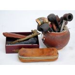 A small collection of various pipes and accoutrements,