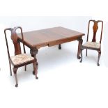 An early 20th century extending dining table and four dining chairs (5).
