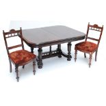 A mahogany extending D-end dining table on fluted and ring turned tapering supports to bun feet