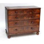 A 19th century mahogany chest of two short and three long graduated drawers raised on bun feet,