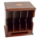 An Edwardian mahogany and satinwood inlaid table top stationery rack, width 28th.