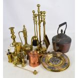 A collection brass ware including a four piece companion set, Eastern lidded jug, Indian plaques,