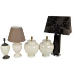 Four cream glazed ceramic table lamps including a near pair of ovoid form,