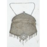 A German Alpacca metal mesh Art Deco style purse with chain tassels and stylised floral decoration