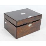 A 19th century rosewood vanity box with mother of pearl cartouche and escutcheon,