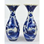 A pair of early 20th century Japanese porcelain ovoid vases with flared and crimped rims,