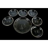 A set of six clear glass circular shallow bowls, diameter 17cm, and a matching serving bowl,