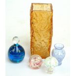 A small group of decorative glass including a Mdina paperweight,