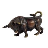 An early 20th century bronze figure of a bull, length 5cm.