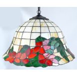 A 20th century stained glass lamp shade in the Tiffany style, width 47cm.