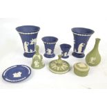 WEDGWOOD; a pair of dark blue jasperware tapering vases decorated with classical figures,