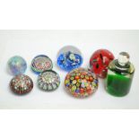 A group of eight glass paperweights of varying form and size including a Caithness 'Myriad' example