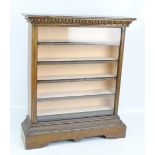 An early 20th century oak collectors' cabinet with glazed front and five shelves/side drawers on