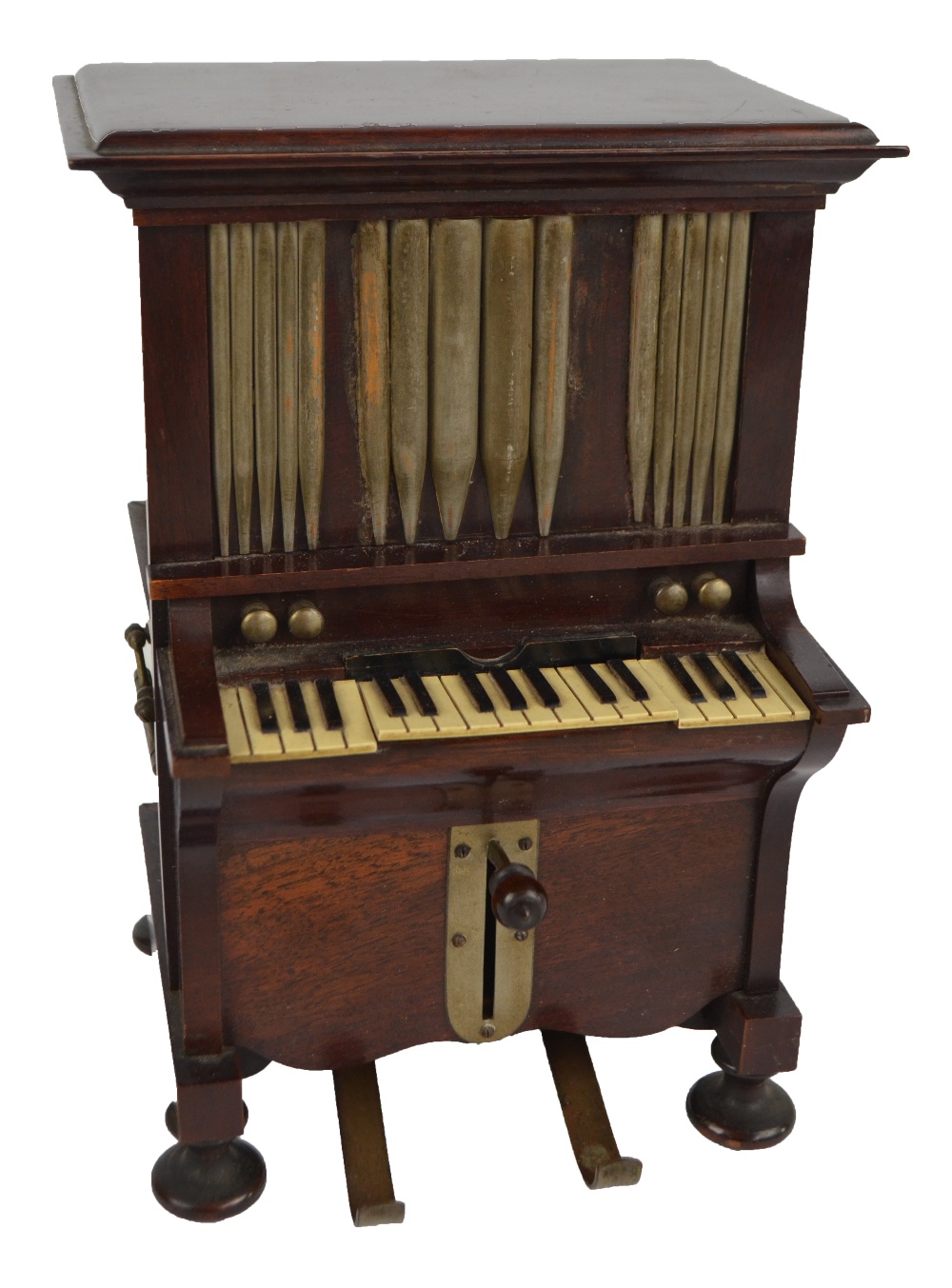 An early 20th century novelty mahogany smoker's compendium modelled as pipe organs with hinged lid