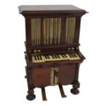 An early 20th century novelty mahogany smoker's compendium modelled as pipe organs with hinged lid