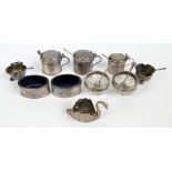 A group of various cruets to include a pair of cylindrical mustards, Atkin Bros, Sheffield 1912,