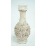A large alabaster vase with band of incised leaf moulded decoration, height 56cm.