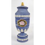 WEDGWOOD; a three coloured marble jasperware bell shaped vase and cover with gilt finial,