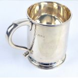 CS HARRIS & SONS LTD; a George V hallmarked silver mug of tapering form with S-scroll handle,